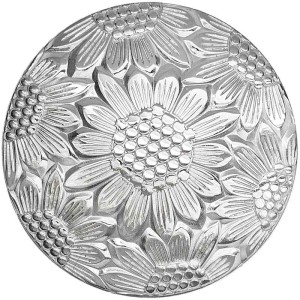 A hand engraved custom silver concho in antique finish featuring a sunflower pattern 